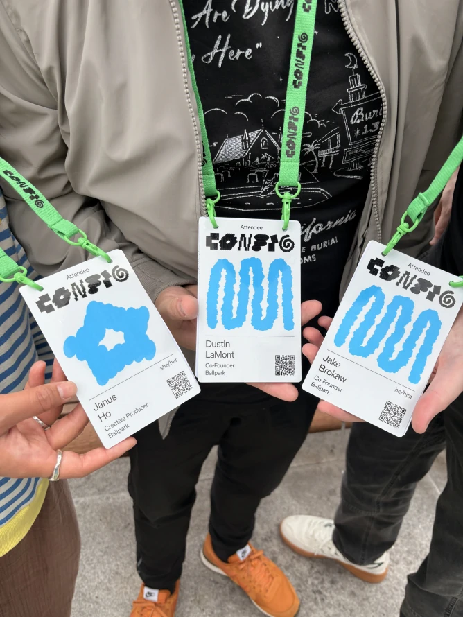 Janus, Dustin, and Jake holding their CONFIG conference badges