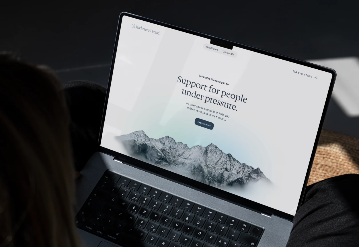 Inclusive Health website on laptop — marketing site showing the platform value